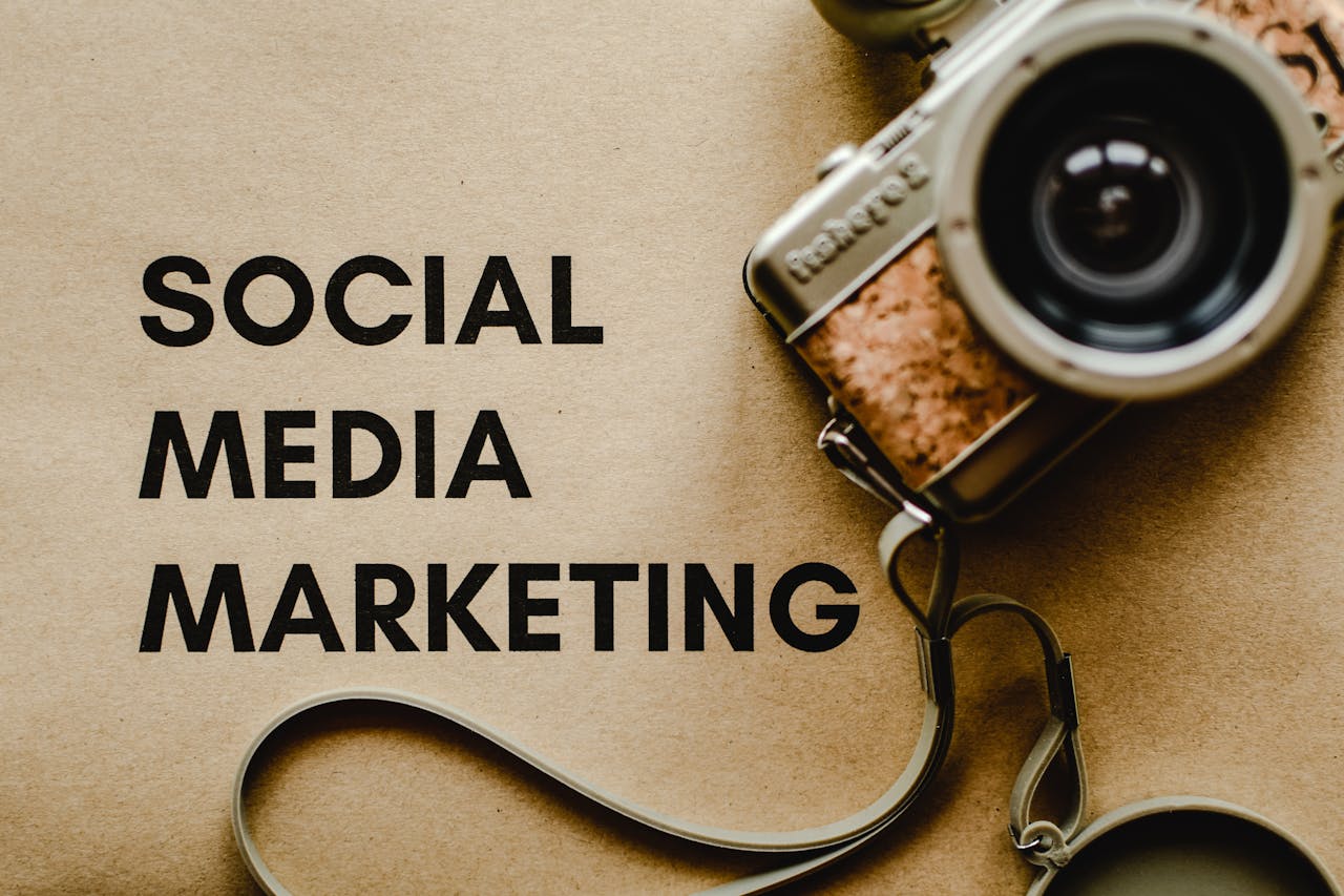 A vintage camera on brown paper with SOCIAL MEDIA MARKETING text, perfect for marketing visuals.